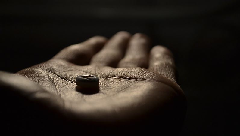Pill in hand